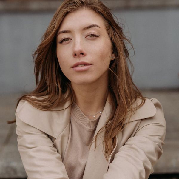 A silhouette of a person in a balanced pose against a stylized background.